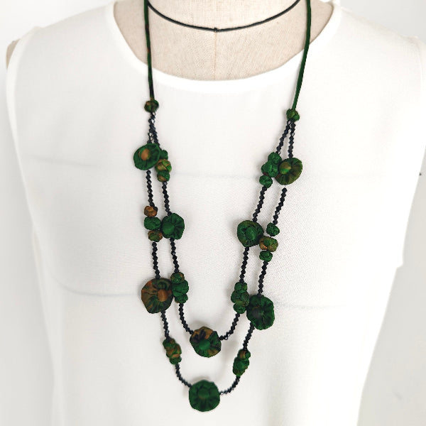Xiangyunsha fabric bead layered necklace in dark plum on white background