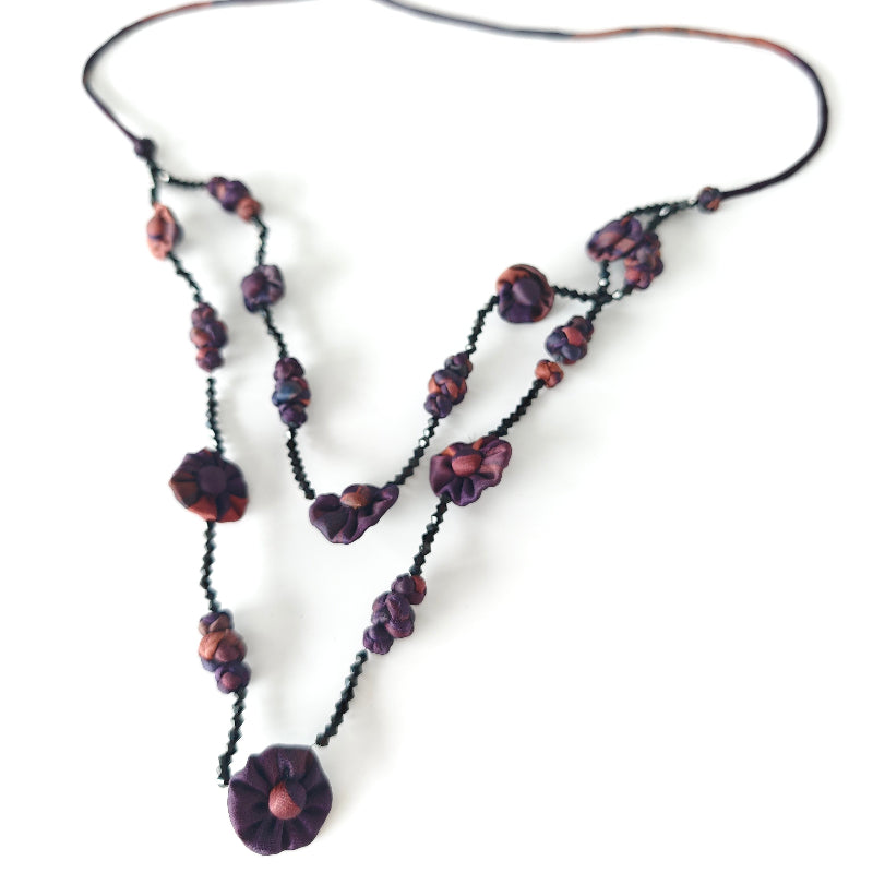 Xiangyunsha fabric bead layered necklace in crimson red on white background