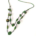 Xiangyunsha fabric bead layered necklace in dark plum styled on mannequin